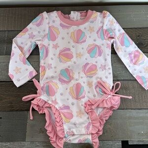 CADEN LANE LONG SLEEVE RASH GUARD WITH RUFFLE BOTTOM | BEST SELLERS